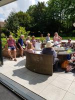 Club members enjoying a pizza